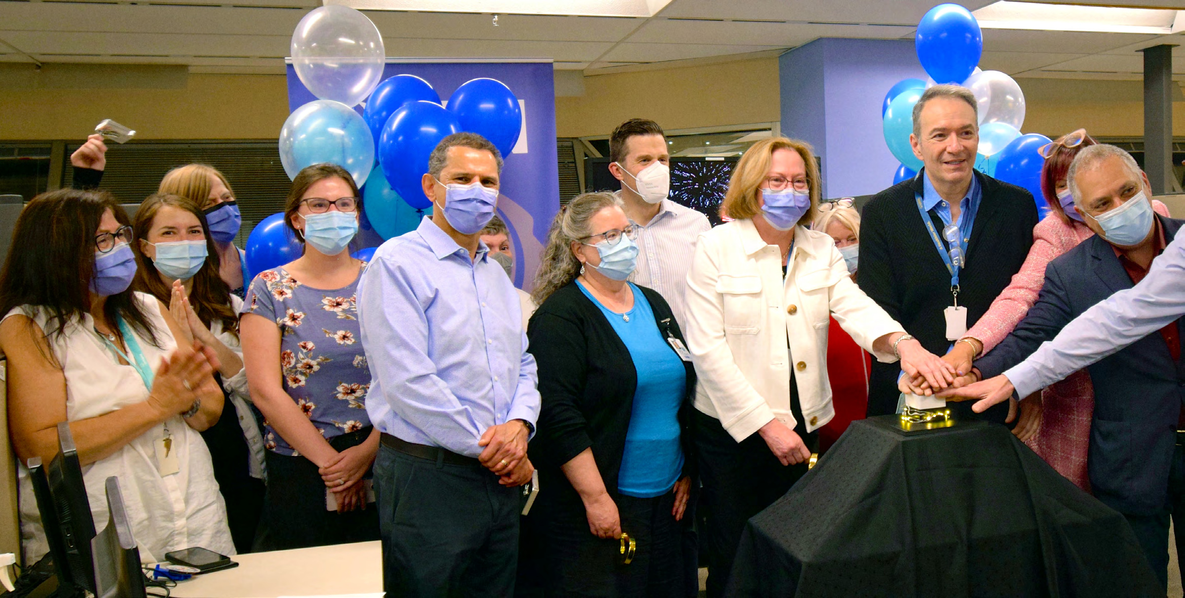 UHN senior leaders push the button symbolizing Epic go-live in the Atrium of Toronto General Hospital.
